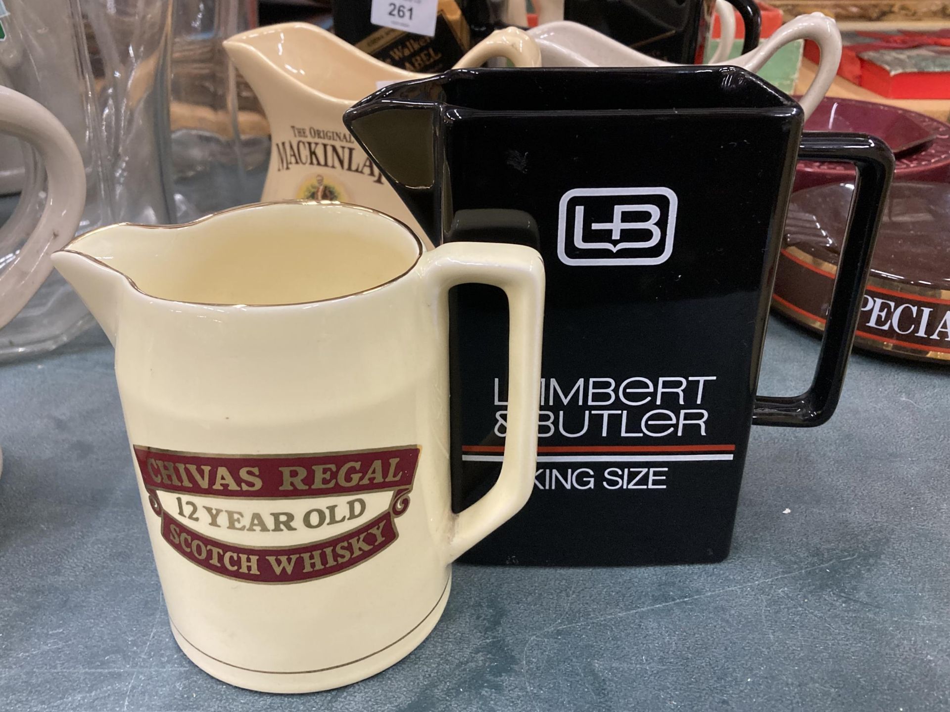 TWO WHISKY WATER JUGS TO INCLUDE LAMBERT AND BUTLER AND CHIVAS REGAL
