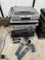 AN ASSORTMENT OF DVD AND VHS PLAYERS TO INCLUDE PHILIPS AND GOODMANS ETC