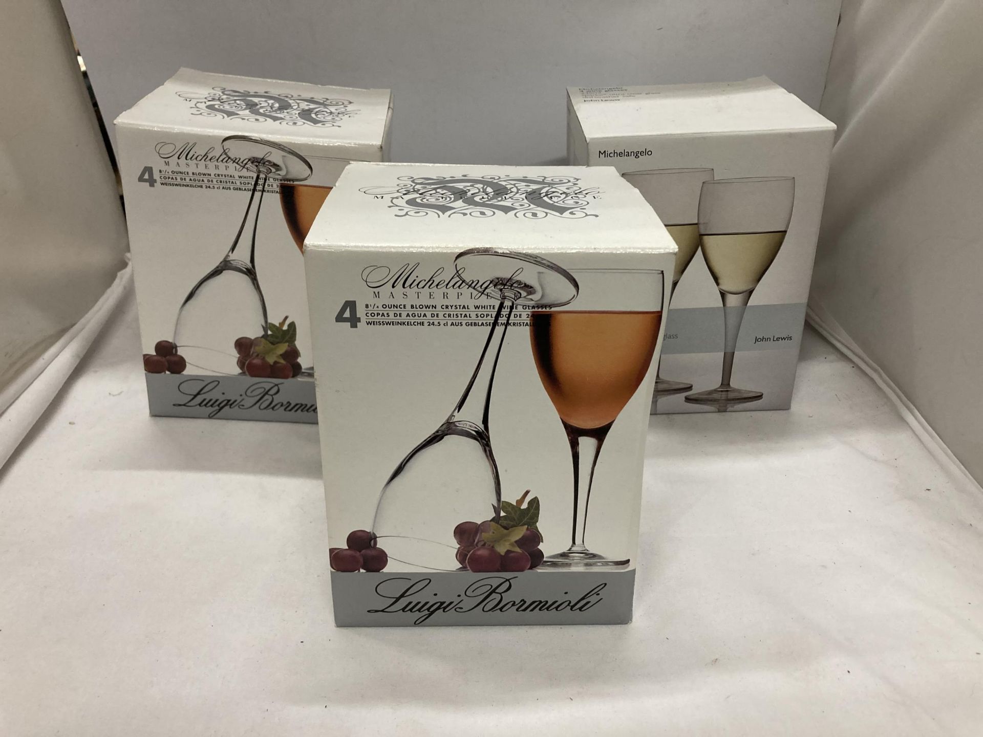 THREE BOXED WINE GLASS SETS, LUIGI BORMIOLI AND JOHN LEWIS
