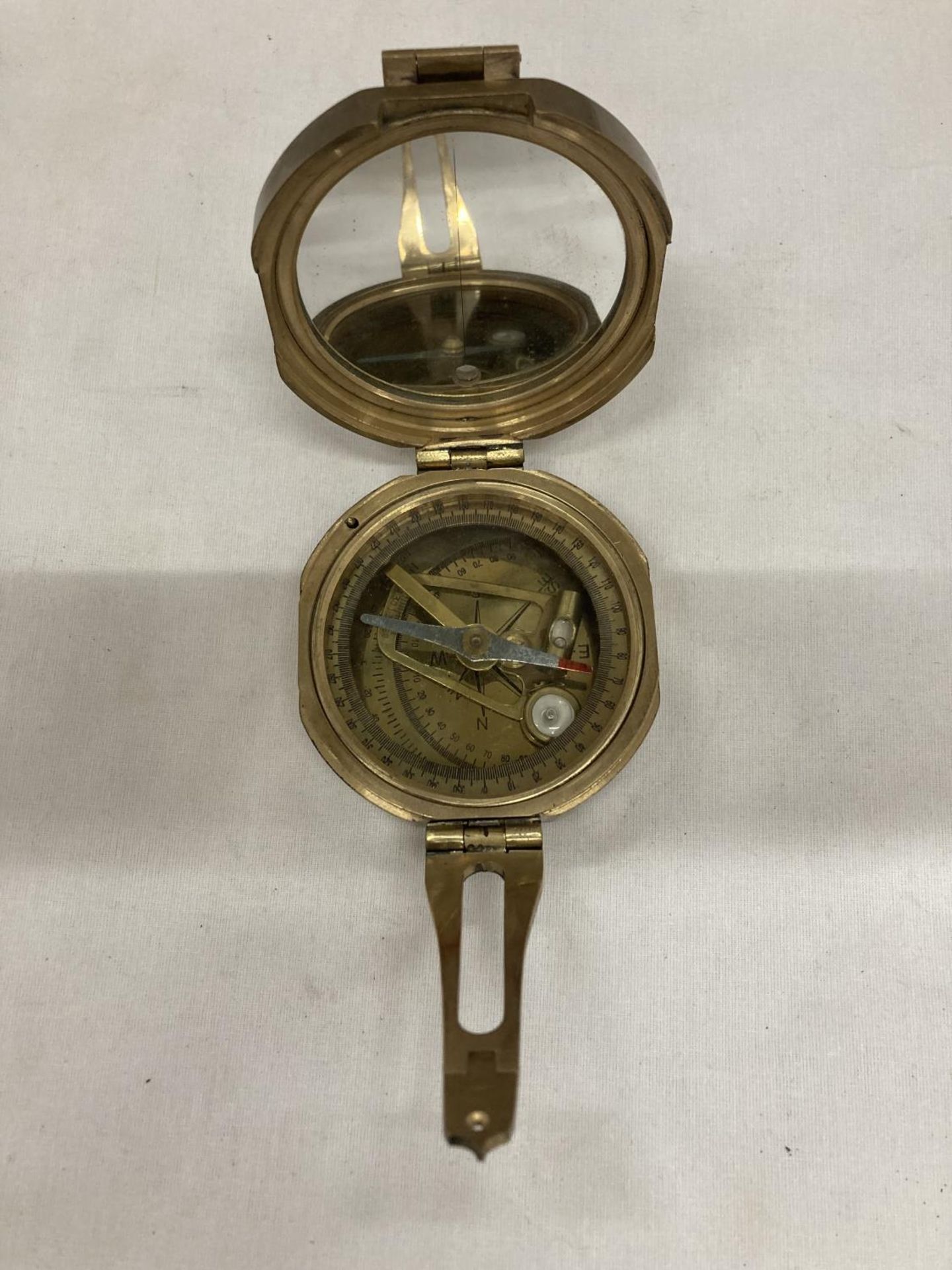 A POLISHED BRASS BRUNTON STYLE EXPLORERS' COMPASS