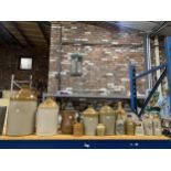 A COLLECTION OF VINTAGE STONEWARE BOTTLES / FLAGONS, INCLUDING LOCAL INTEREST MANCHESTER AND CREWE