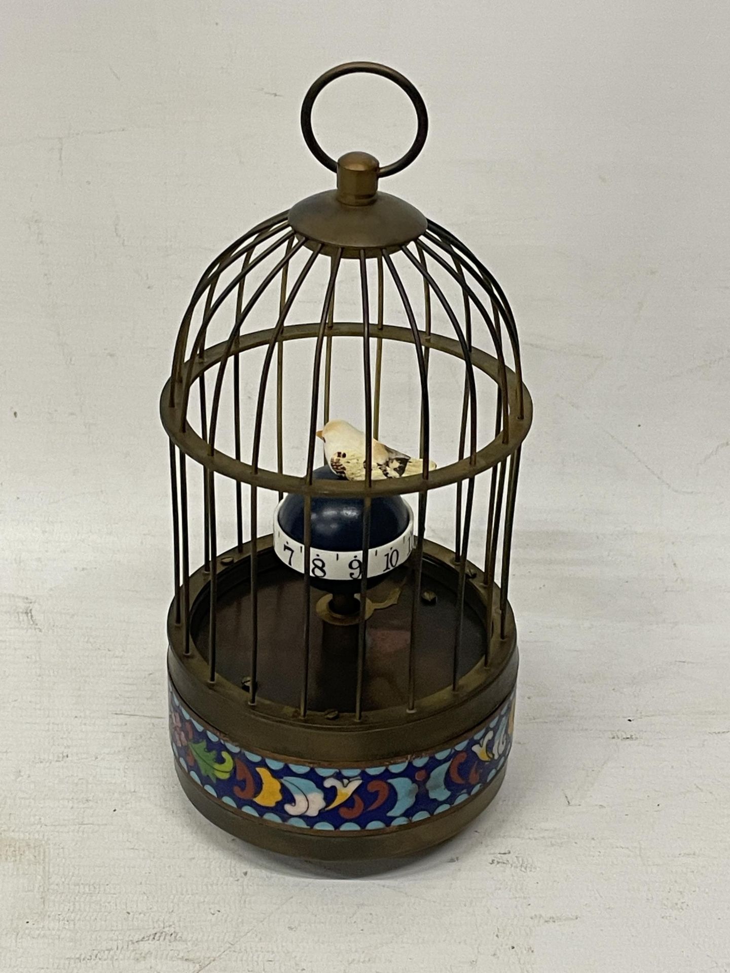 A MECHANICAL BRASS BIRD CAGE CLOCK