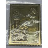 A SILVER GILT 10 1/2P STAMP INGOT