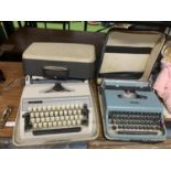 TWO RETRO CASED TYPEWRITERS