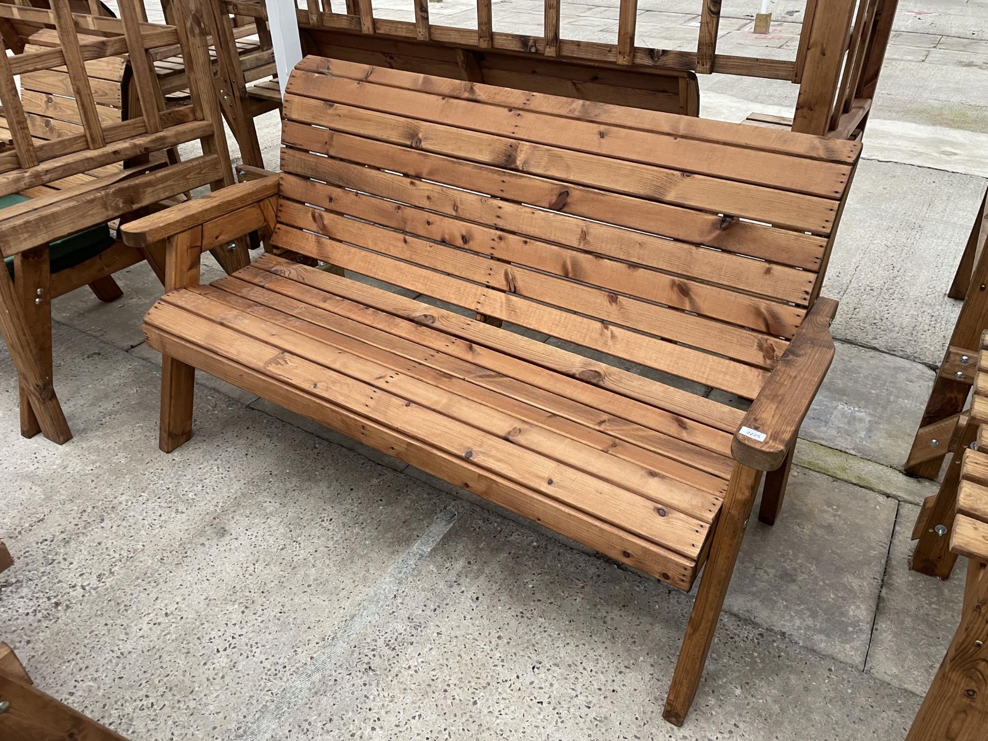AN AS NEW EX DISPLAY CHARLES TAYLOR THREE SEATER BENCH *PLEASE NOTE VAT TO BE ADDED TO THE HAMMER