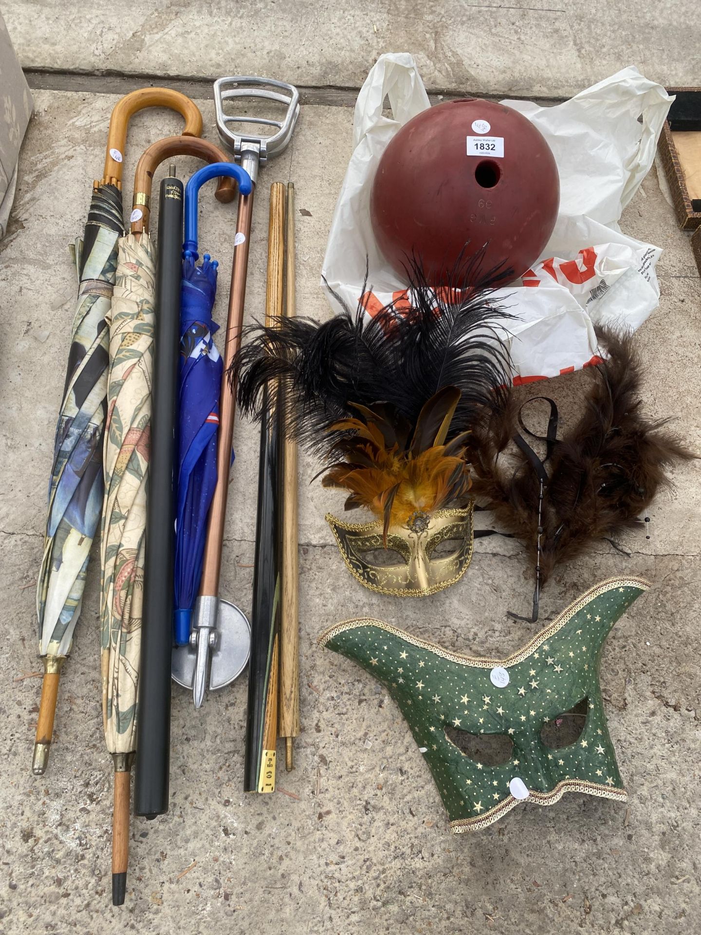 AN ASSORTMENT OF ITEMS TO INCLUDE MASKS, A BOWLING BALL AND A 'LEWIS AND WILSON' SNOOKER CUE ETC