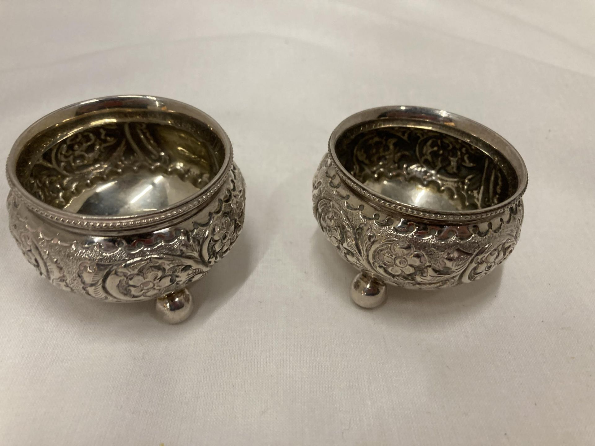 A PAIR OF WHITE METAL CONTINENTAL OPEN SALTS