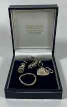 FOUR .925 SILVER ITEMS - MODERN WAVY RING AND THREE PENDANTS - SHOE, SANDAL AND HEART, IN BOX