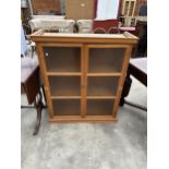 A MODERN HARDWOOD TWO DOOR GLAZED DISPLAY CABINET, 38" WIDE