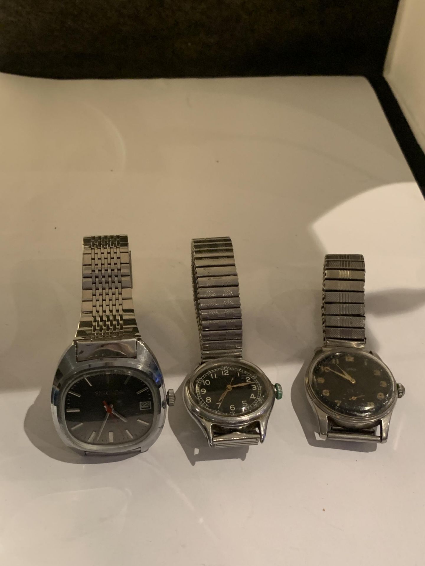 THREE GENTS WATCHES TO INCLUDE A SEKONDA, A LEVER AND A MILITARY STYLE WATCH