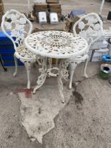 A VINTAGE STYLE ALLOY BISTRO SET COMPRISING OF A ROUND TABLE AND TWO CHAIRS