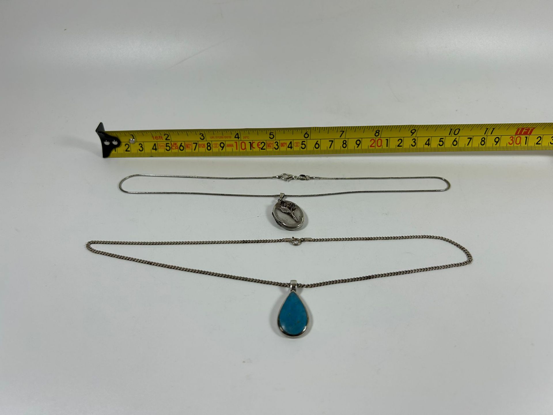 TWO .925 SILVER NECKLACES WITH BLUE STONE AND LOCKET PENDANT DESIGNS, LARGEST 20" CHAIN LENGTH - Image 6 of 6