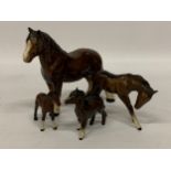 A GROUP OF FOUR BESWICK HORSE AND FOAL FIGURES