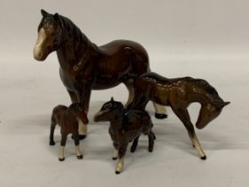 A GROUP OF FOUR BESWICK HORSE AND FOAL FIGURES
