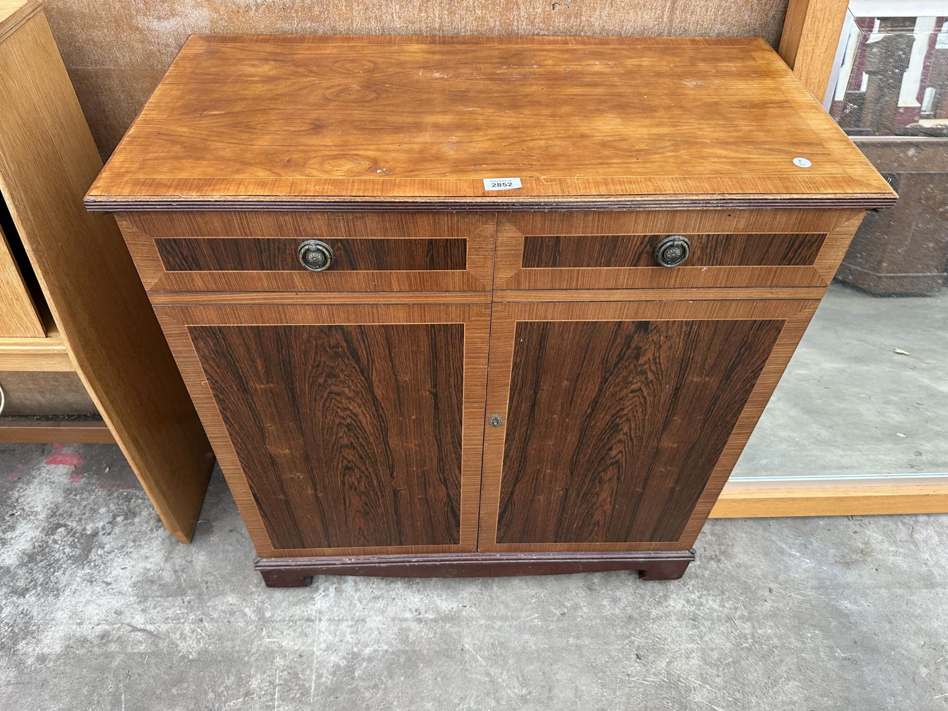 A MODERN ROSEWOOD EFFECT SIDE CABINET, 33" WIDE