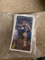 TWO SMALL PACKETS OF OLYMPIC SPORTS CARDS