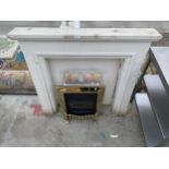 A GAS FIRE WITH DECORATIVE STONE EFFECT SURROUND