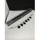 A BOXED SILVER AND JET STONE BRACELET