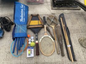 AN ASSORTMENT OF SPORTS EQUIPMENT TO INCLUDE A CRUCIBLE CC LTD SNOOKER CUE, TENNIS RACKETS WITH