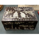 A MOTHER OF PEARL INLAID WOODEN BOX WITH ORIENTAL SCENE TO THE LID