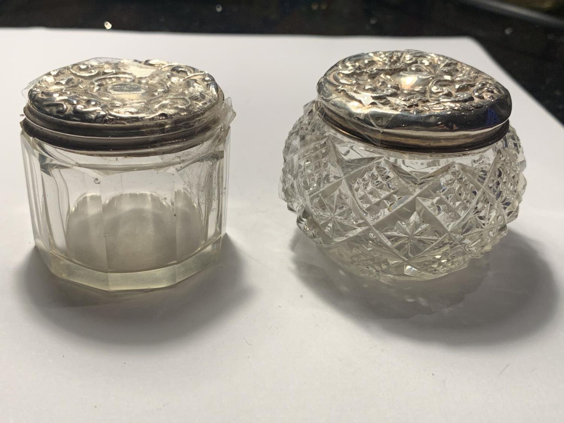 TWO GLASS JARS WITH ORNATE SILVER TOPS - Image 2 of 3