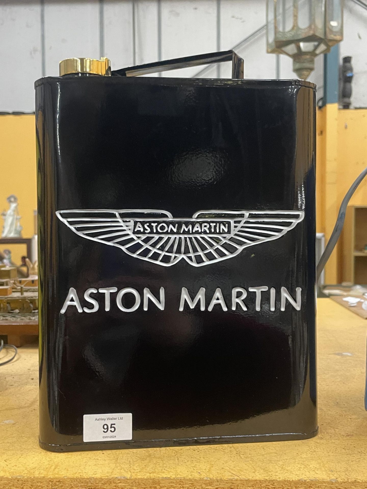 A BLACK ASTON MARTIN PETROL CAN