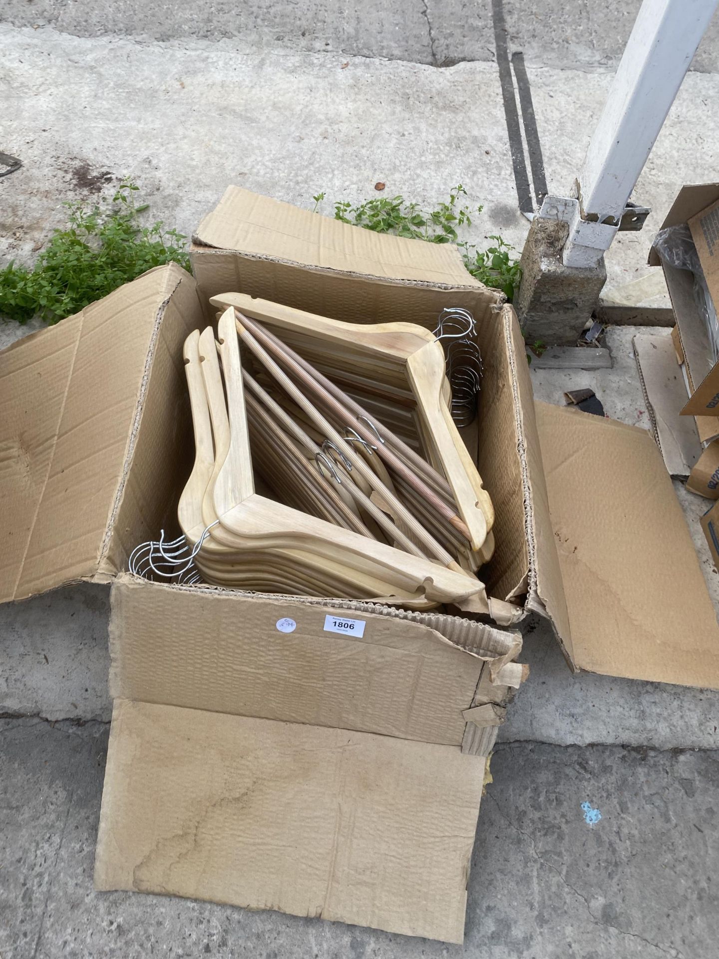 A LARGE QUANTITY OF NEW WOODEN COAT HANGERS