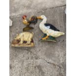 THREE DECORATIVE CAST IRON ANIMAL DOOR STOPS