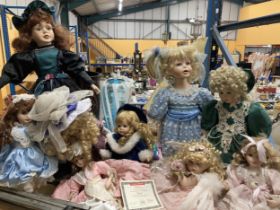 A LARGE COLLECTION OF DOLLS INCLUDING EXAMPLES ON STANDS