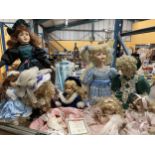 A LARGE COLLECTION OF DOLLS INCLUDING EXAMPLES ON STANDS