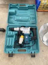 A MAKITA 110V SDS DRILL WITH CARRY CASE
