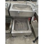AN INDUSTRIAL STAINLESS STEEL TWO TIER SINK UNIT