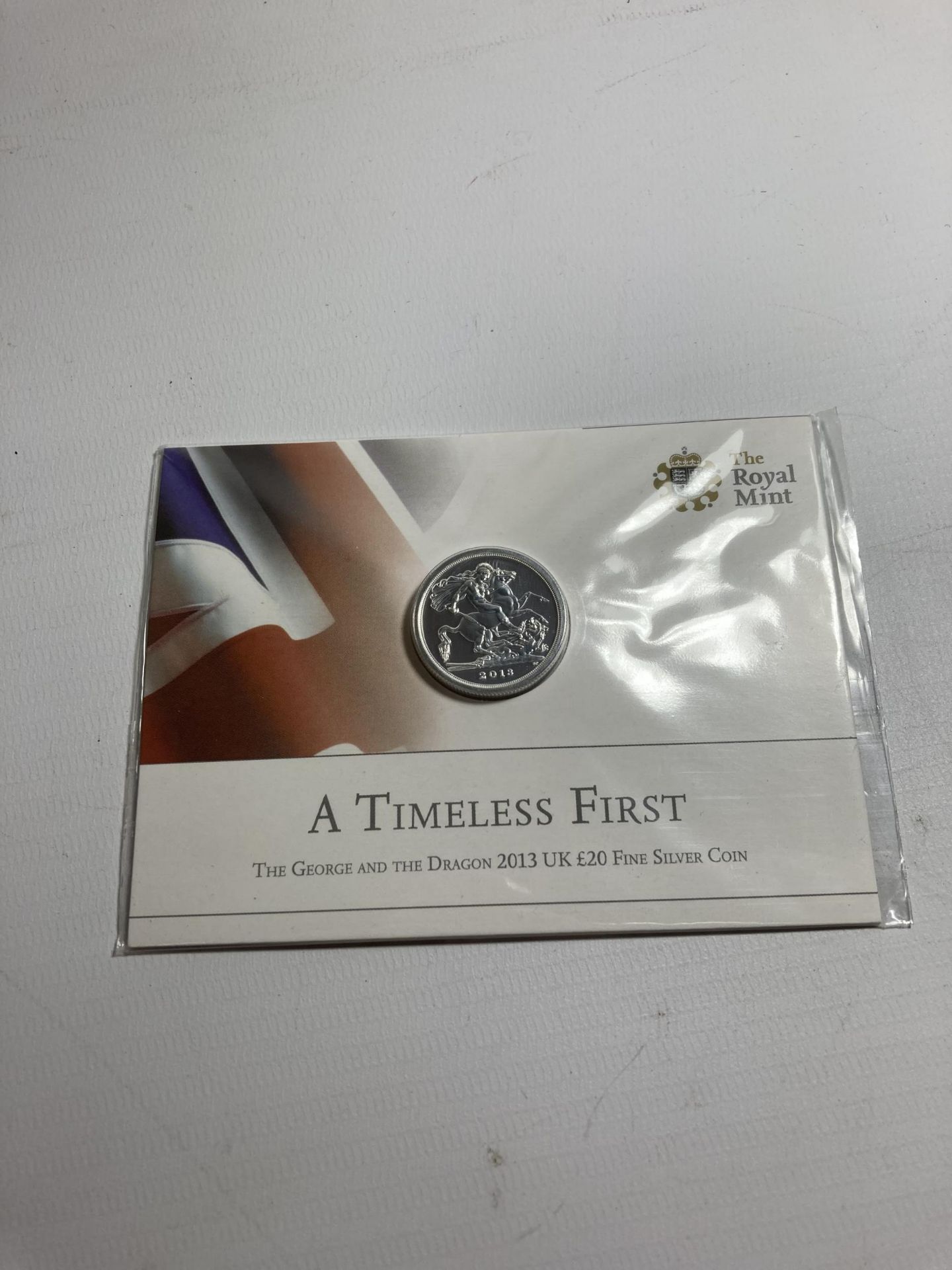 A ROYAL MINT GEORGE AND THE DRAGON 2013 UK £20 FINE SILVER COIN