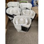 A LARGE QUANTITY OF PLASTIC MOP BUCKETS WITH WET FLOOR WARNINGS