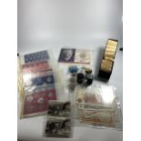 A MIXED LOT OF COINS TO INCLUDE SIX CASED UK SETS , VARIOUS UK COINS IN TUBS , PLUS A BLACK