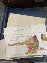 AN ALBUM CONTAINING UK AND WORLDWIDE STAMPS AND A QUANTITY OF FIRST DAY COVERS