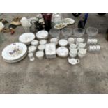 AN ASSORTMENT OF GLASS AND CERAMIC WARE TO INCLUDE CUPS, BOWLS AND PLATES ETC