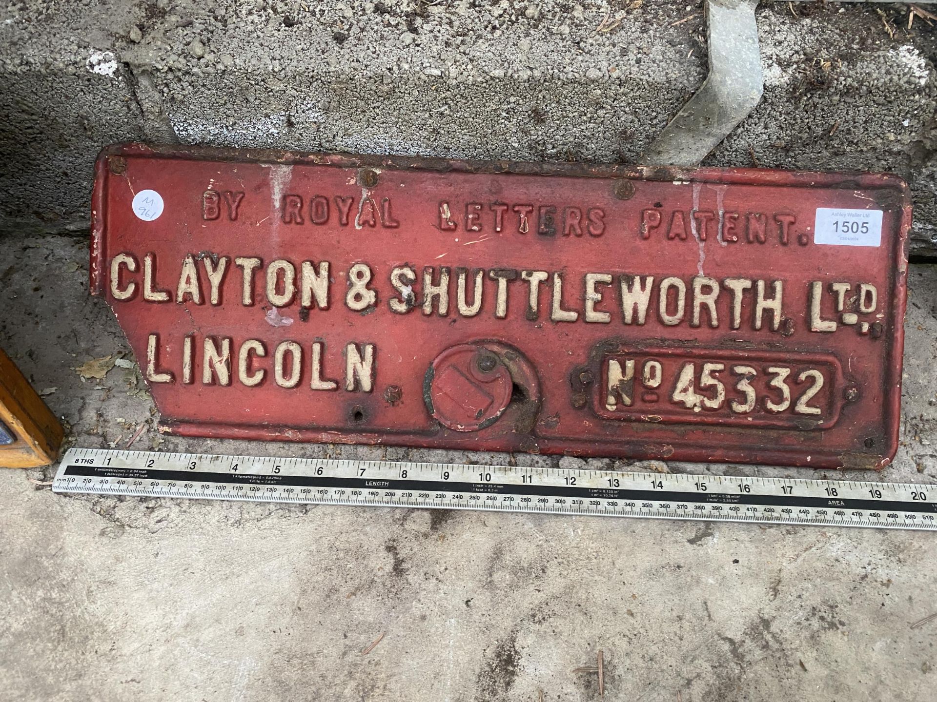 A RECTANGULAR CAST METAL 'CLAYTON & SHUTTLEWORTH LTD' SIGN