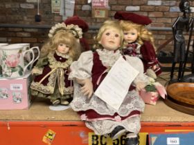 A GROUP OF THREE DOLLS INCLUDING HAMILTON COLLECTION EXAMPLE
