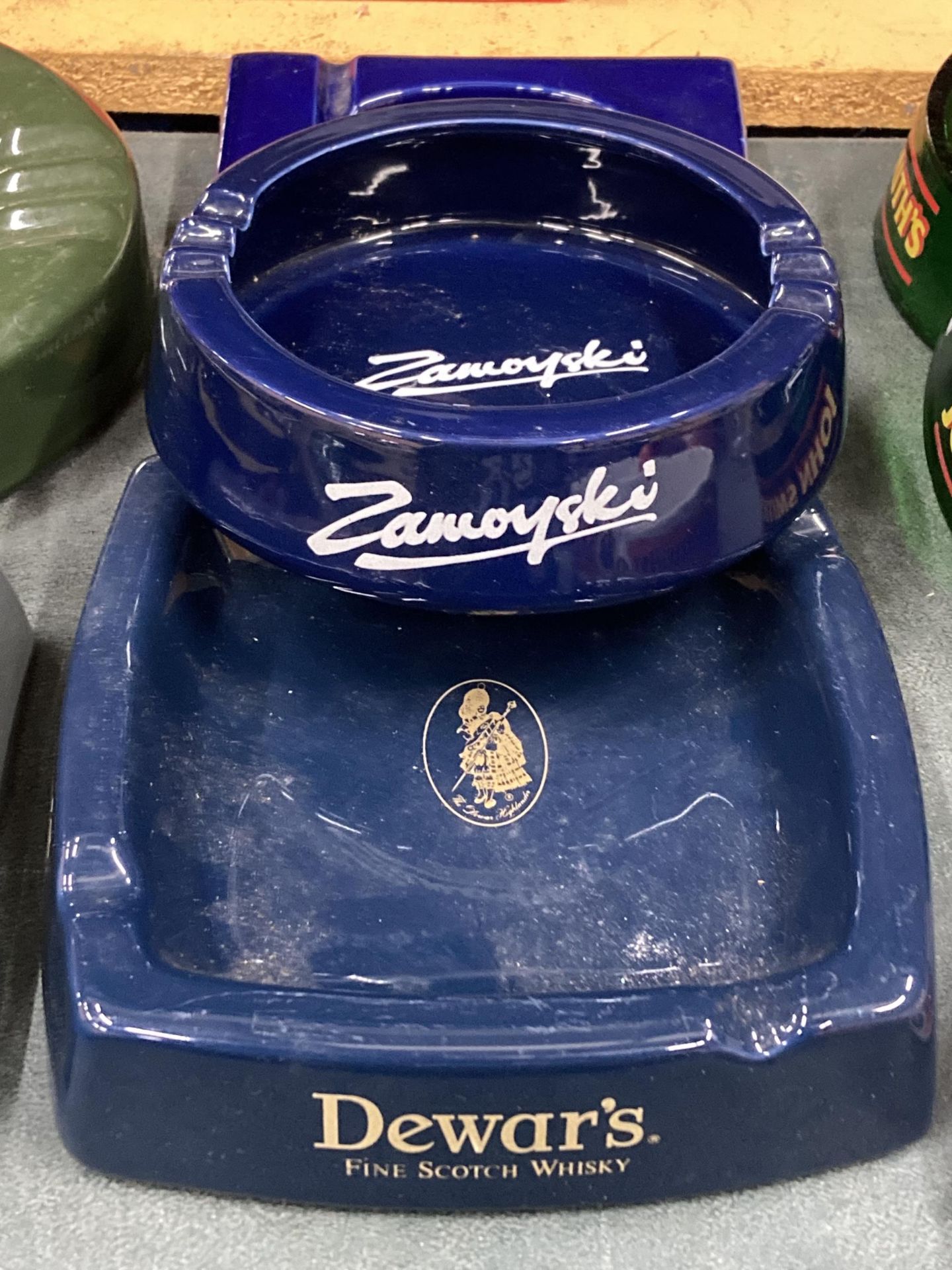 THREE CERAMIC ASHTRAYS TO INCLUDE MARTINI, DEWARS AND ZAMOYSKI