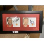 A FRAMED MANCHESTER UNITED SIGNED PICTURE - PATRICE EVRA AND PAUL SCHOLES