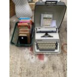 A RETRO GABRIELE 25 TYPEWRITER AND AN ASSORTMENT OF MAPS