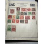 A CAVALIER STAMP ALBUM CONTAINING A COLLECTION OF VARIOUS WORLD STAMPS