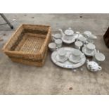 AN ASSORTMENT OF ITEMS TO INCLUDE A WICKER BASKET AND A TEA SERVICE ETC