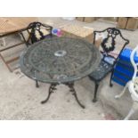 A VINTAGE STYLE ALLOY BISTRO SET COMPRISING OF A ROUND TABLE AND TWO CHAIRS