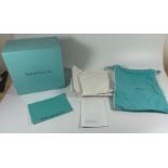 A TIFFANY & CO CLOCK / JEWELLERY BOX WITH CLOTH AND MANUAL, BOX LENGTH 16CM