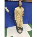 A HEAVY LOUIS ARMSTRONG FIGURE WITH TRUMPET AND MICROPHONE 22 INCHES TALL
