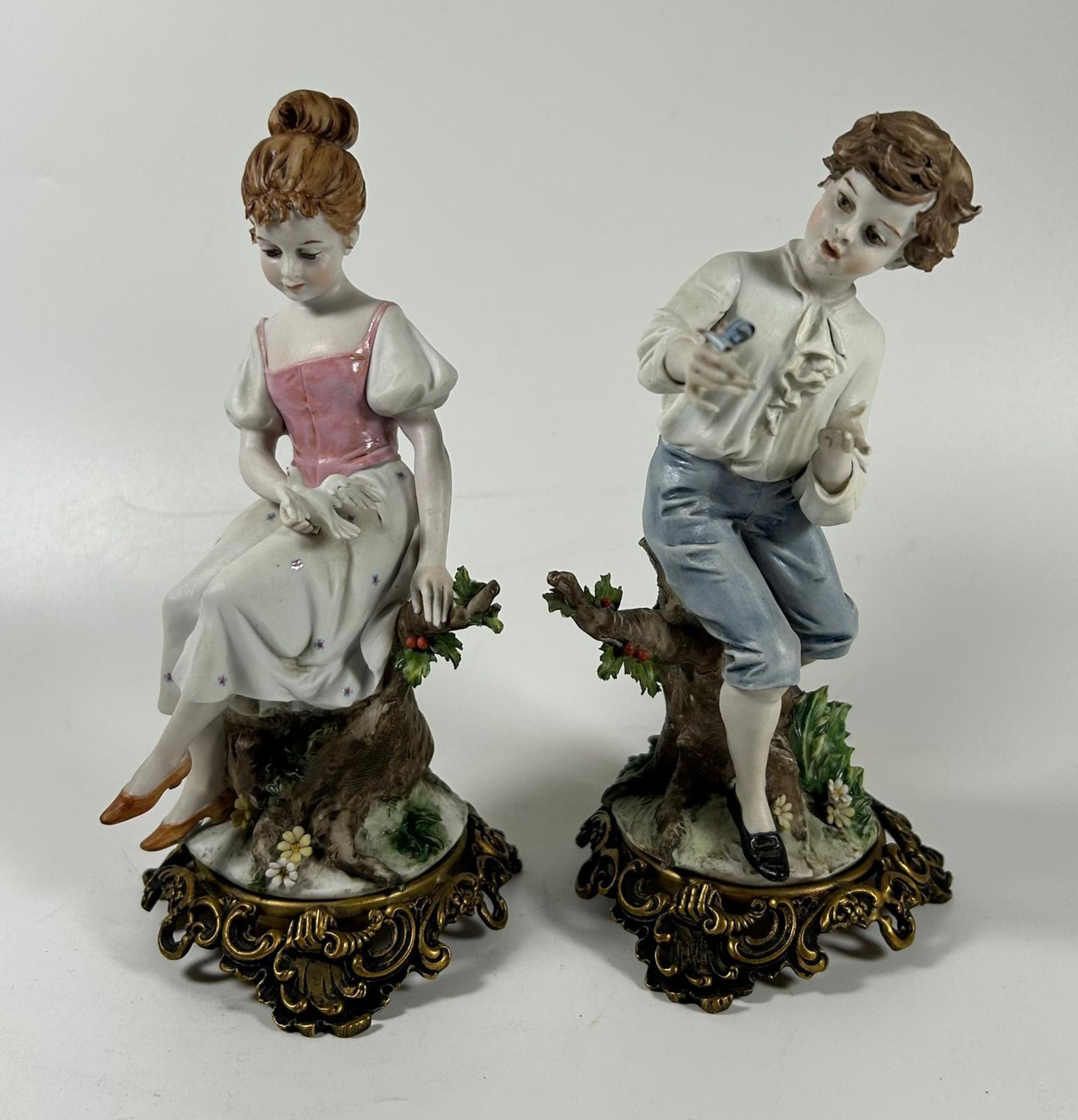 A PAIR OF CONTINENTAL PORCELAIN FIGURES OF A BOY AND GIRL ON GILT METAL BASES - Image 2 of 4