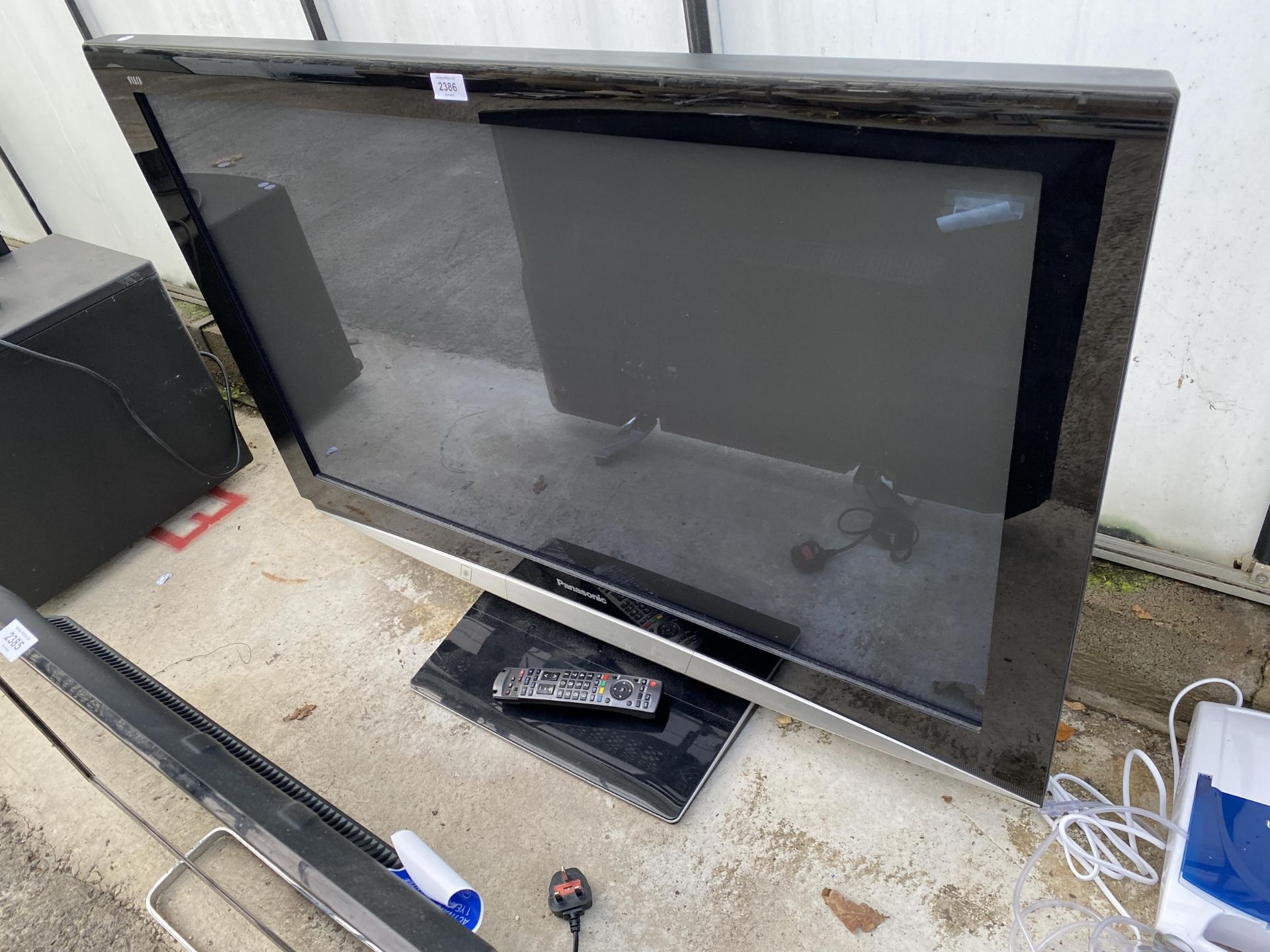 A PANASONIC 46" TELEVISION WITH REMOTE CONTROL