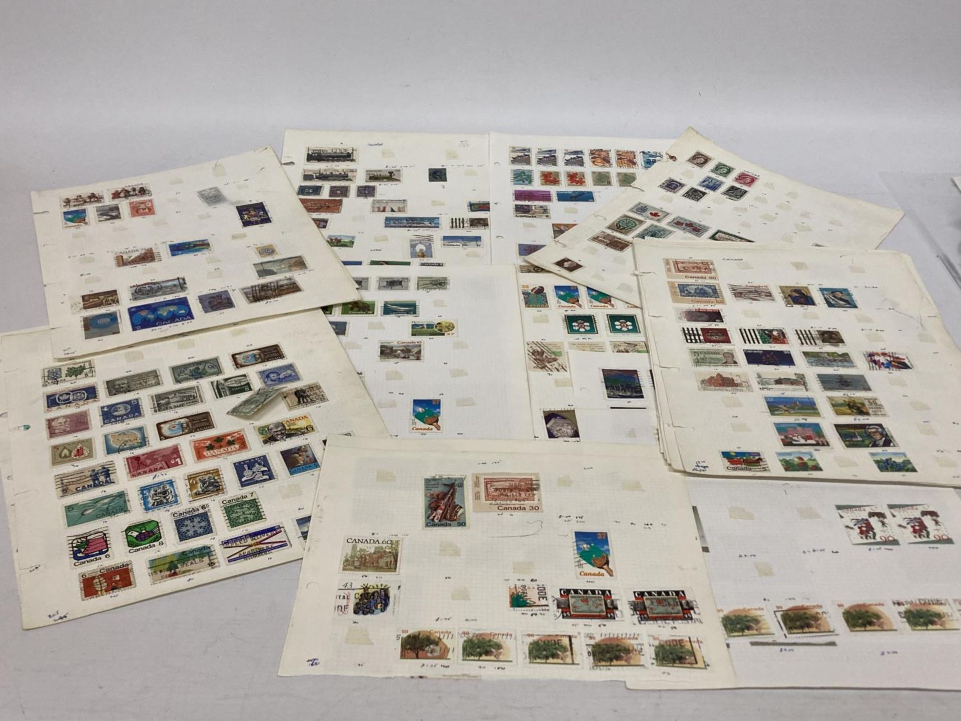 TEN PLUS SHEETS CONTAINING STAMPS FROM CANADA